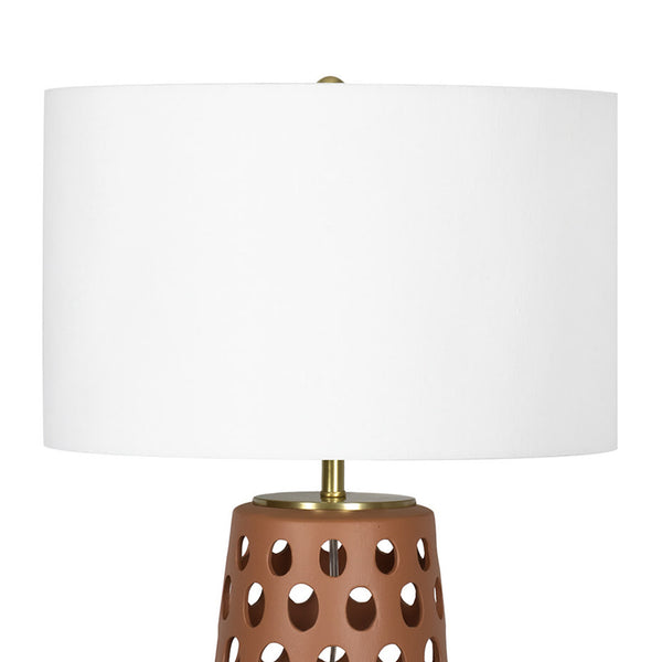 Kelvin Ceramic Table Lamp - Natural light can filter through perforations on t