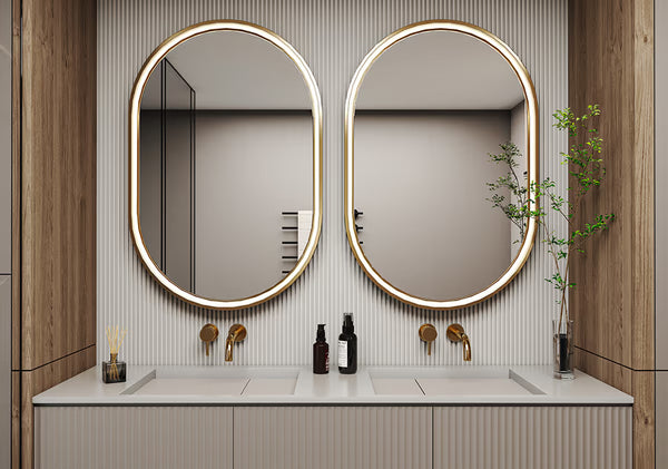 Bathroom vanity with two round mirrors, lighting fixtures, and decorative elements.