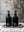 Two black bottles labeled 'Tatine Kashmir' on a decorative tray with a blurred background