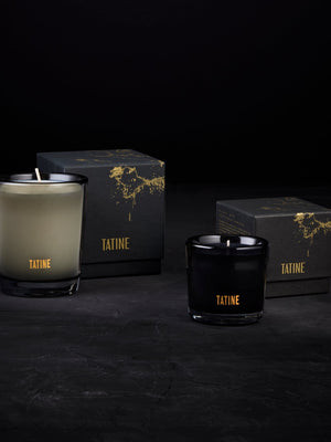 Tatine candles and packaging on a dark background
