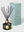 Reed diffuser with black sticks and gold cap next to its packaging on a light gray background